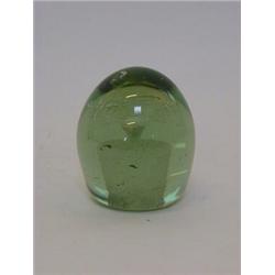 A GREEN GLASS DUMPY PAPERWEIGHT, floral inclusion, height 10cm  20-30...