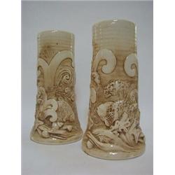 A PAIR OF BRETBY ART POTTERY SLEEVE VASES, late 19th Century, moulded sea life subjects, cream gl...