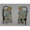 Image 1 : A PAIR OF TINTED BISQUE PIANO BABY FIGURES, late 19th Century, seated on bentwood chairs, height...