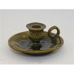 A BRETBY ART POTTERY CHAMBER CANDLESTICK, early 20th Century, all over green glaze, No.2450, heig...