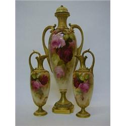 A ROYAL WORCESTER GARNITURE, 1915, pair of ewers and covered amphora vase, rose decoration, signe...