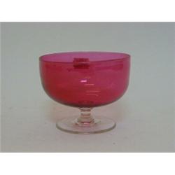 A RUBY GLASS BOWL, on clear gadget marked base, diameter 20cm  30-40...
