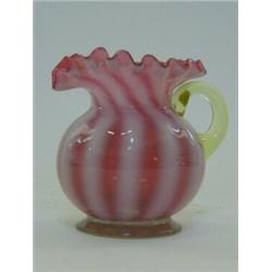 A CREAM JUG, striped pink opaline fluted rim, vaseline handle, clear pontil marked base, height 9...