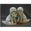 Image 1 : A PAIR OF GLAZED SPANIEL FIGURES, late 19th Century, each carrying a basket of piglets, height 18...