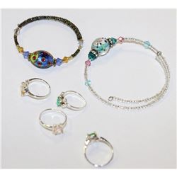 2 CHILDRENS BRACELETS WITH 4 STERLING SILVER CHILD