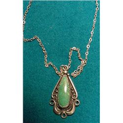 Sterling Silver & Turquoise Navajo Style Pendant on a Chain. Pendant is stamped “bell Sterling”.