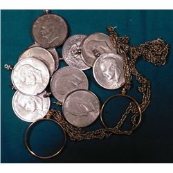 (2) Gold-plated Chains for 39mm Medals with chains; & (10) Dollar Bezels with Eisenhower Dollars.