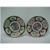 Image 1 : A pair of Imari chargers, each with six panels of dragon and floral decoration, center floral des...