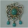 Image 1 : 14K gold pin with turquoise colored stones, synthetic oval turquoise surrounded by eight small st...