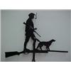 Image 1 : Sheet aluminum weathervane with silhouette of man with pipe holding gun, with dog standing on sho...
