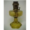 Image 1 : Amber Aladdin glass oil lamp, Model B, six sided base, 13" high Estimate 100/200...