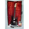 Image 1 : Fender Stratocaster electric guitar "Big Apple Strat", black body with marbleized red on black fa...