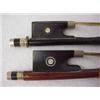 Image 2 : Two violin bows, mother of pearl on metal ends, repaired Estimate 100/200...