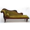 Image 1 : Victorian carved mahogany chaise longue with button upholstery on turned legs…