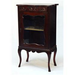 Edwardian mahogany music cabinet, the moulded serpentine top above a drawer and glazed door enclo…