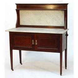 Edwardian inlaid mahogany washstand with marble back and top above a pair of cupboard doors on ta…