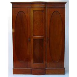 Victorian mahogany wardrobe with moulded cornice above a bowed centre panel, flanked on either si…