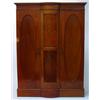 Image 1 : Victorian mahogany wardrobe with moulded cornice above a bowed centre panel, flanked on either si…