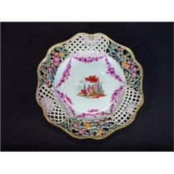 Meissen pierced hand painted floral plate, the central panel decorated with swags of purple flowe…