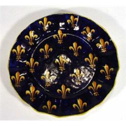 Cantalani faience plate with fluted edge hand painted with  golden fleur-de-lys onto a blue groun…