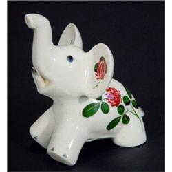 Seated Plitcha elephant hand painted with flowers, marks to base, 10cm high…