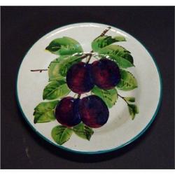 Wemyss pottery plate hand painted with sprigs of plums and leaves, retailed by T Goode & Co Londo…