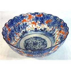 Japanese Imari bowl hand painted with trees and flowers and a central panel of dragons, 24 cm in …