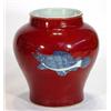 Image 1 : Red glazed oriental vase transfer printed with a band of blue and white fish, 21cm high…