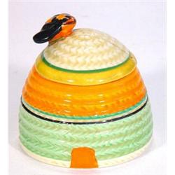 Clarice Cliff Bizarre 'Beehive' honey pot decorated in bands of green, orange and yellow, Bizarre…