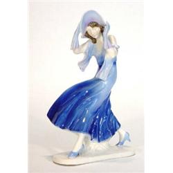 Hand painted Art Deco style porcelain figurine of a windswept lady in a flowing blue dress, impre…