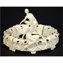 White glazed Goebels Art Deco flower posy ring with scantily clad maidens on zigzag base, impress…