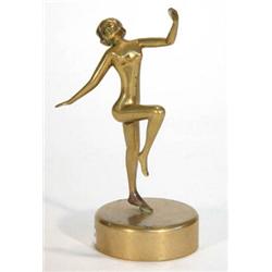 Brass Art Deco naked maiden with outstretched arms and leg on a circular base, 18cm high…