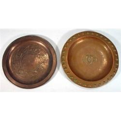 Two copper Arts & Crafts circular dishes, embossed with stylised flowers, largest 25cm diameter…