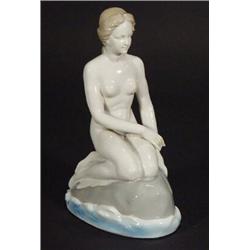 Grey glazed Continental porcelain mermaid seated on a rock, marks to base, 25cm high…