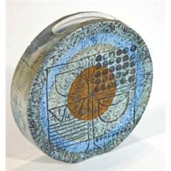 Circular Troika vase incised with an abstract pattern and decorated in oranges, blues and greens,…