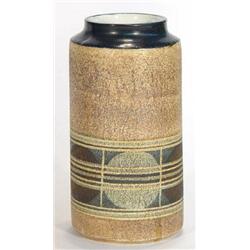 Cylindrical Troika pottery vase decorated with an abstract band of circles and stripes, marks and…