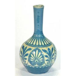 C.H. Brannam pottery vase decorated with a band of blue and cream stylised leaves, incised marks …