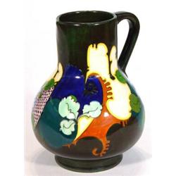 Hand painted Gouda pottery jug decorated with birds amongst stylised flowers, marks to base, 20cm…