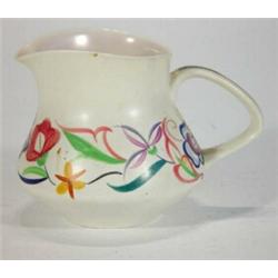 Small Poole pottery jug hand painted with flowers, marks to base, 10cm high…