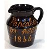 Image 1 : Treacle glazed Victorian pottery jug entitled 'Pancakes for All, 1846', 19cm high…