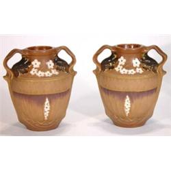 Pair of twin handled 'Amphora' pottery twin handled vases, moulded with leaves and flowers, impre…