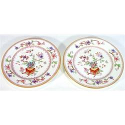 Pair of Worcester plates hand coloured and transfer printed with oriental style flowers, marks to…