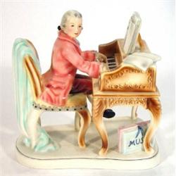 Hand painted Goldscheider porcelain figurine of a piano player, marks to base, 23cm high…