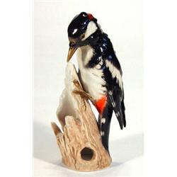 Hand painted Goebels woodpecker on a branch, marks to base, 18cm high…