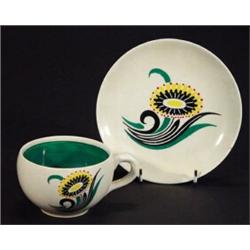 1950's Wade cup and saucer decorated with a stylised flower, marks to base…