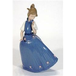 Hand painted Lladro figurine of a girl in a flowing blue ball gown, printed marks to base, 29cm h…