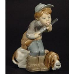 Hand painted Lladro 'Child Hunter and Dog', impressed and printed marks to base, 20cm high…