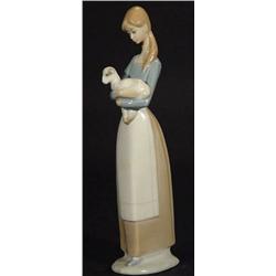 Hand painted Lladro 'Daisa' figurine  clutching a lamb, impressed and printed marks to base, 28cm…