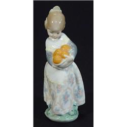 Hand painted Lladro figurine of girl clutching a basket of oranges in floral dress, impressed and…