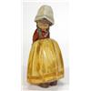 Image 1 : Lladro figurine of a girl with crossed arms in an orange and brown dress, printed marks to base…